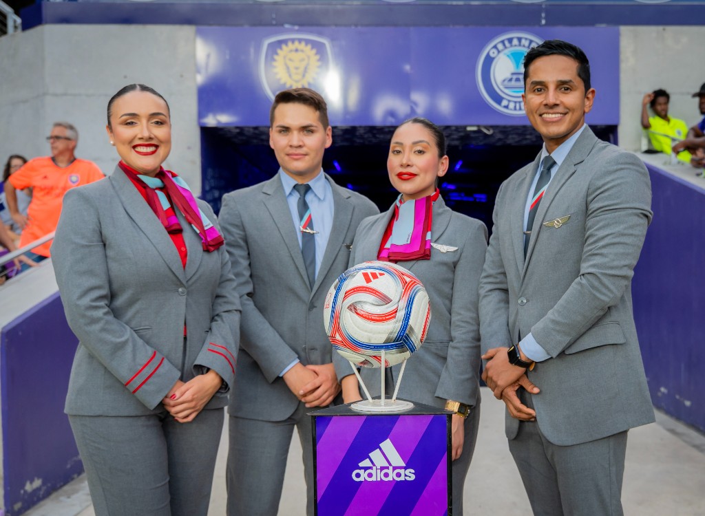Avianca flight crew with an Adidas soccer ball at the Orlando City SC and Orlando Pride stadium tunnel
