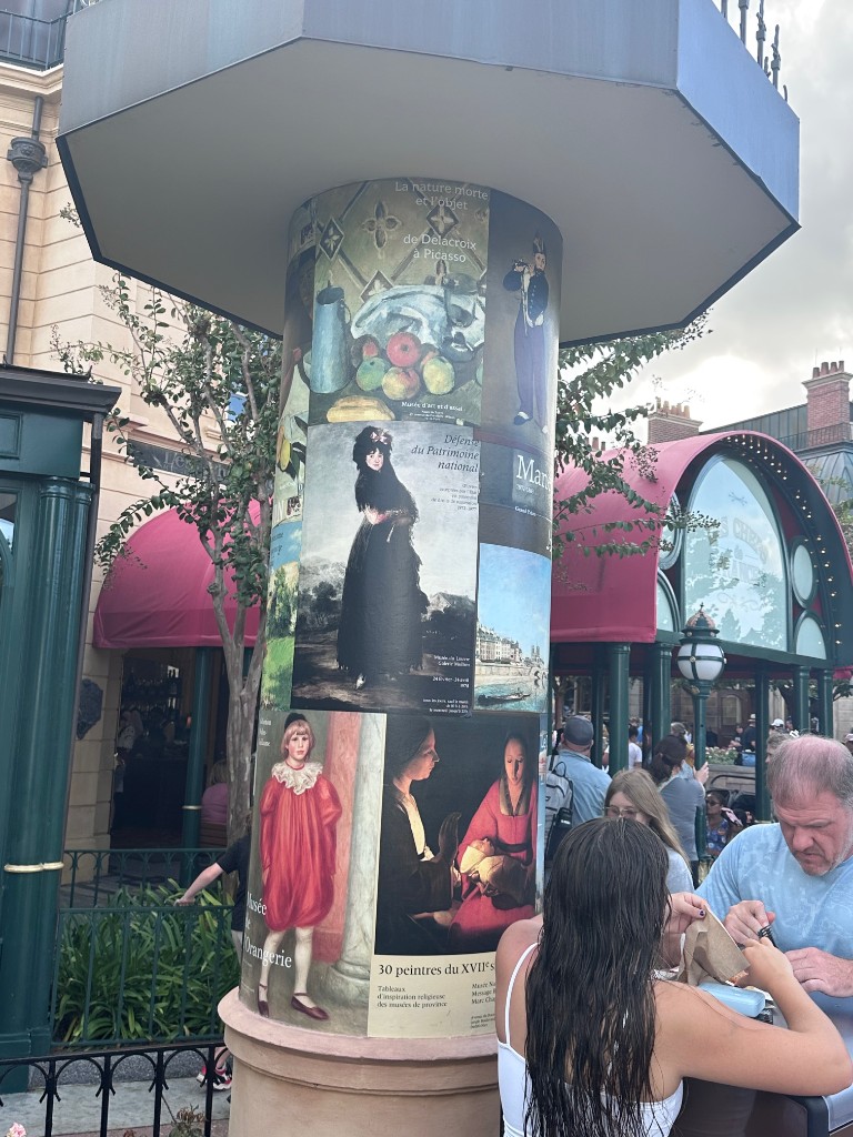 Art poster column with Chefs de France visible behind it