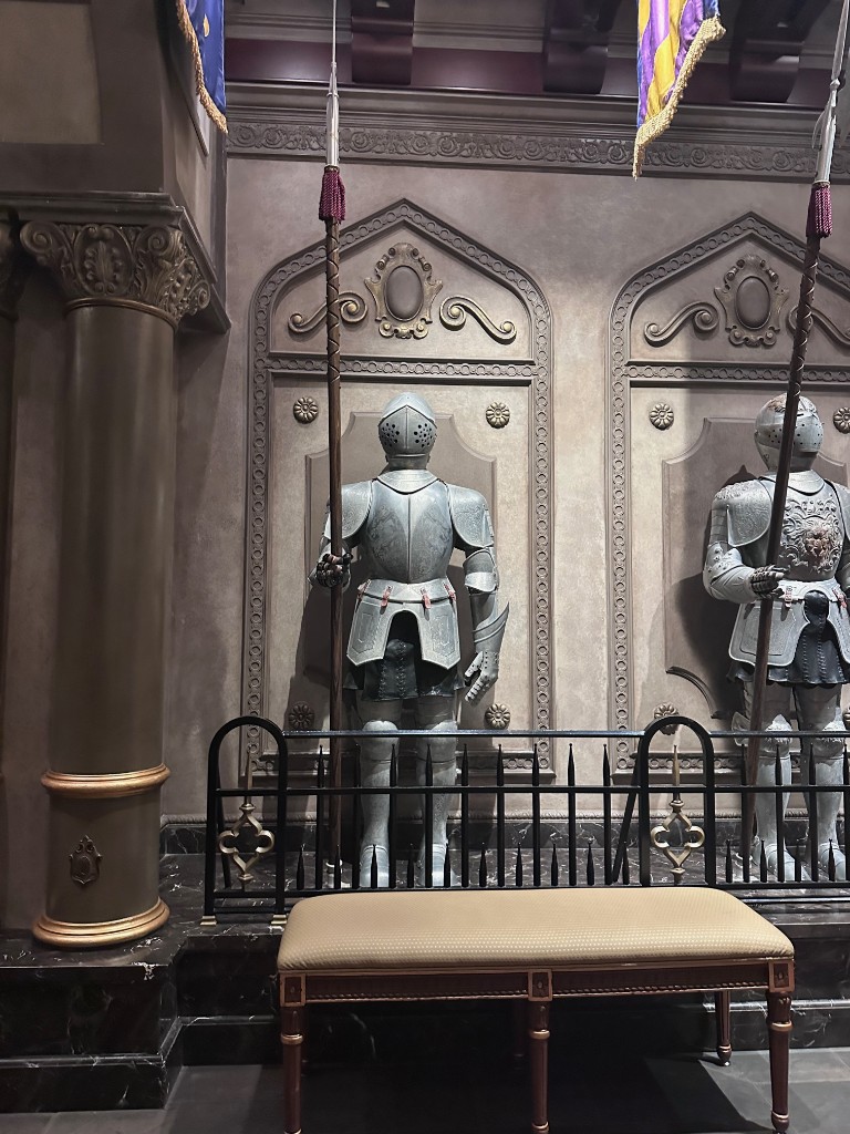 Armor display and bench inside Be Our Guest