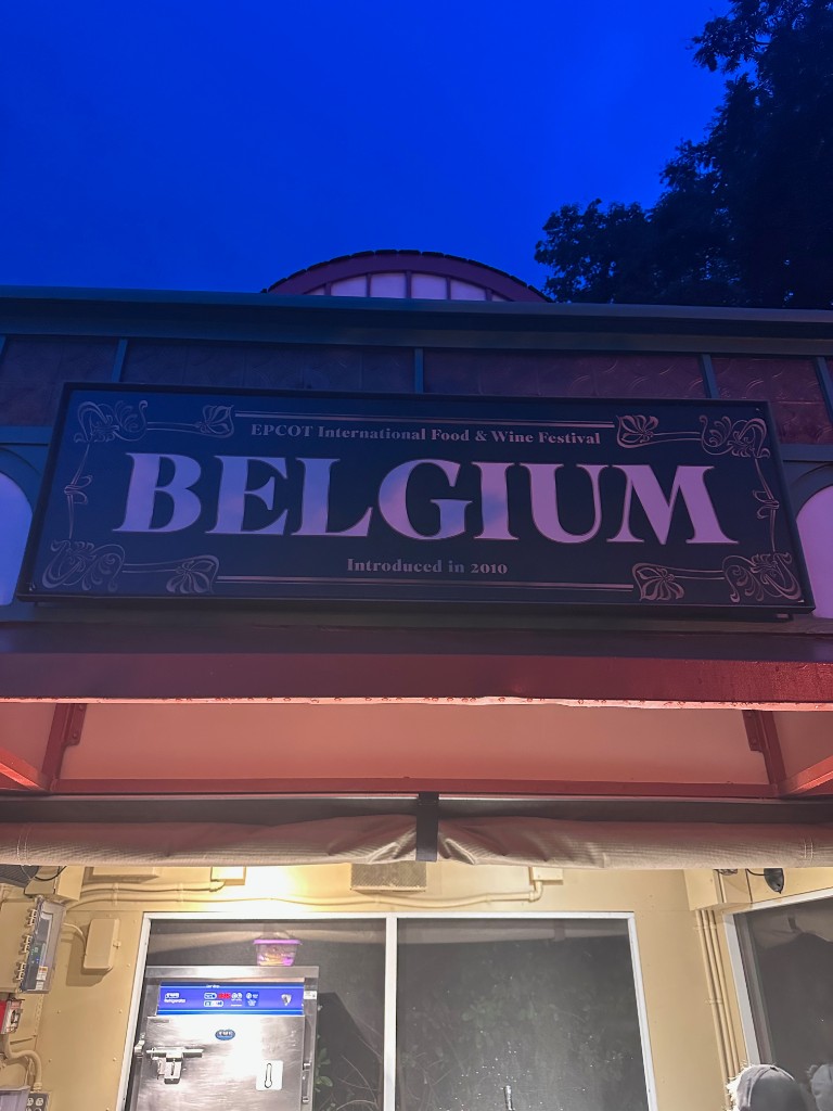 Belgium Food and Wine Festival booth sign at night