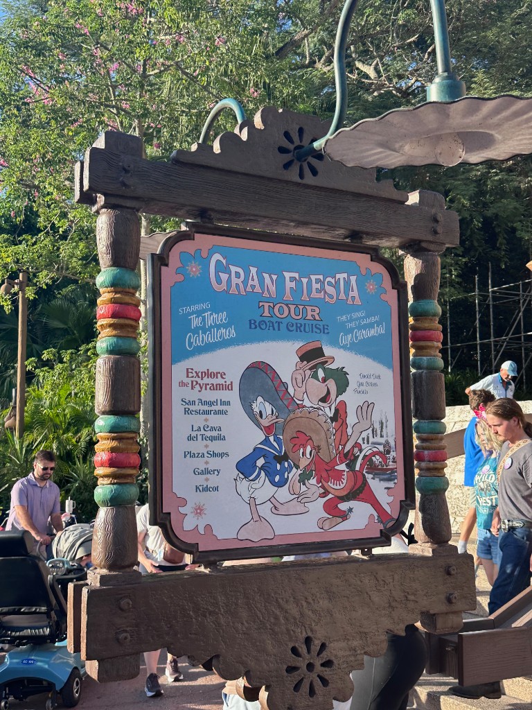 Gran Fiesta Tour Boat Cruise outdoor sign with The Three Caballeros