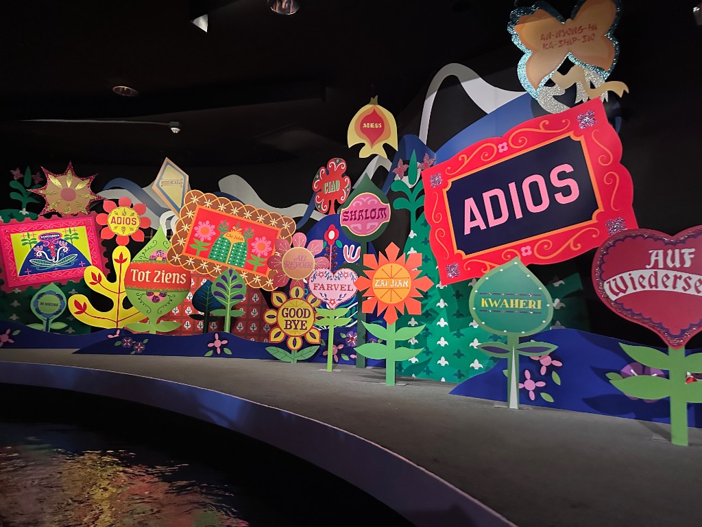 Goodbye wall in many languages at the end of it’s a small world