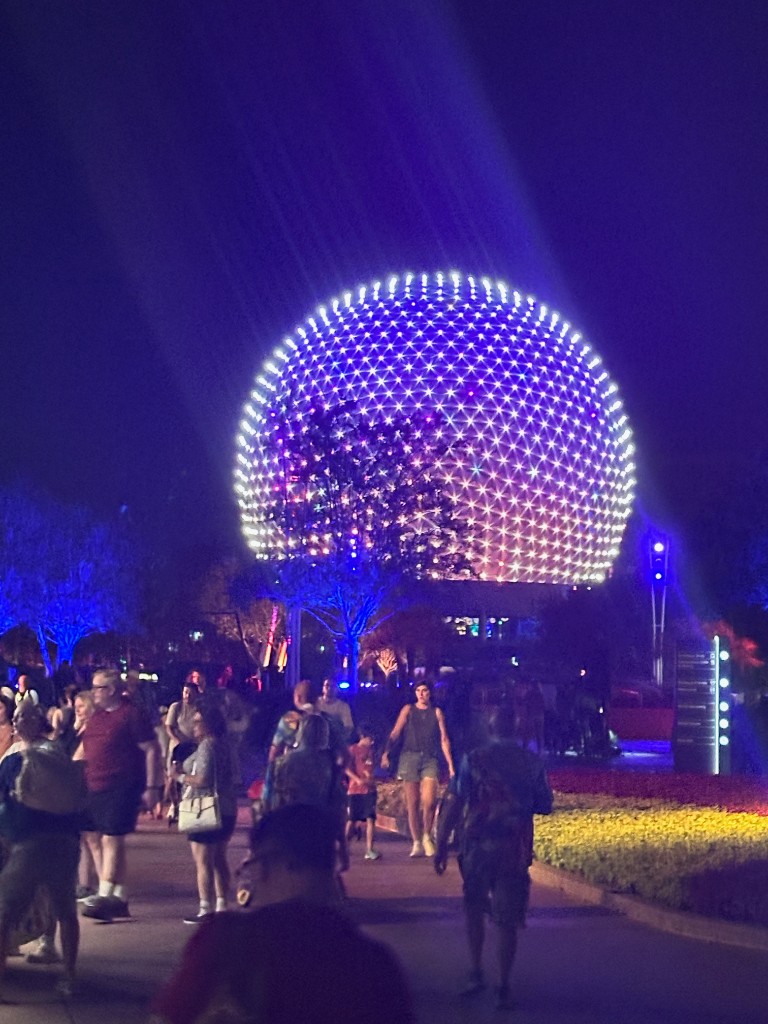 Spaceship Earth lit at night