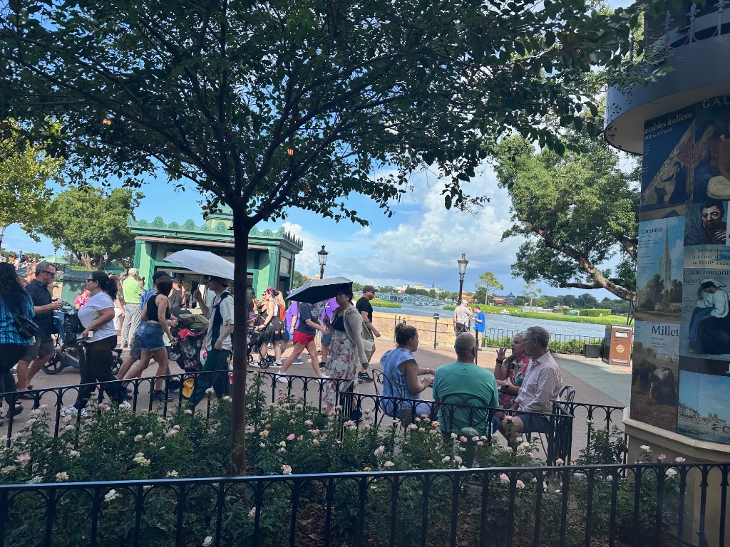 Busy France pavilion plaza facing World Showcase Lagoon