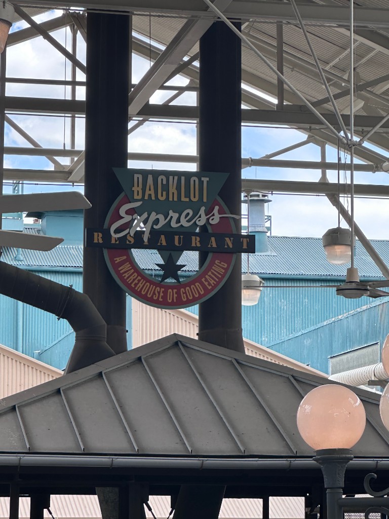 Backlot Express sign under the covered patio