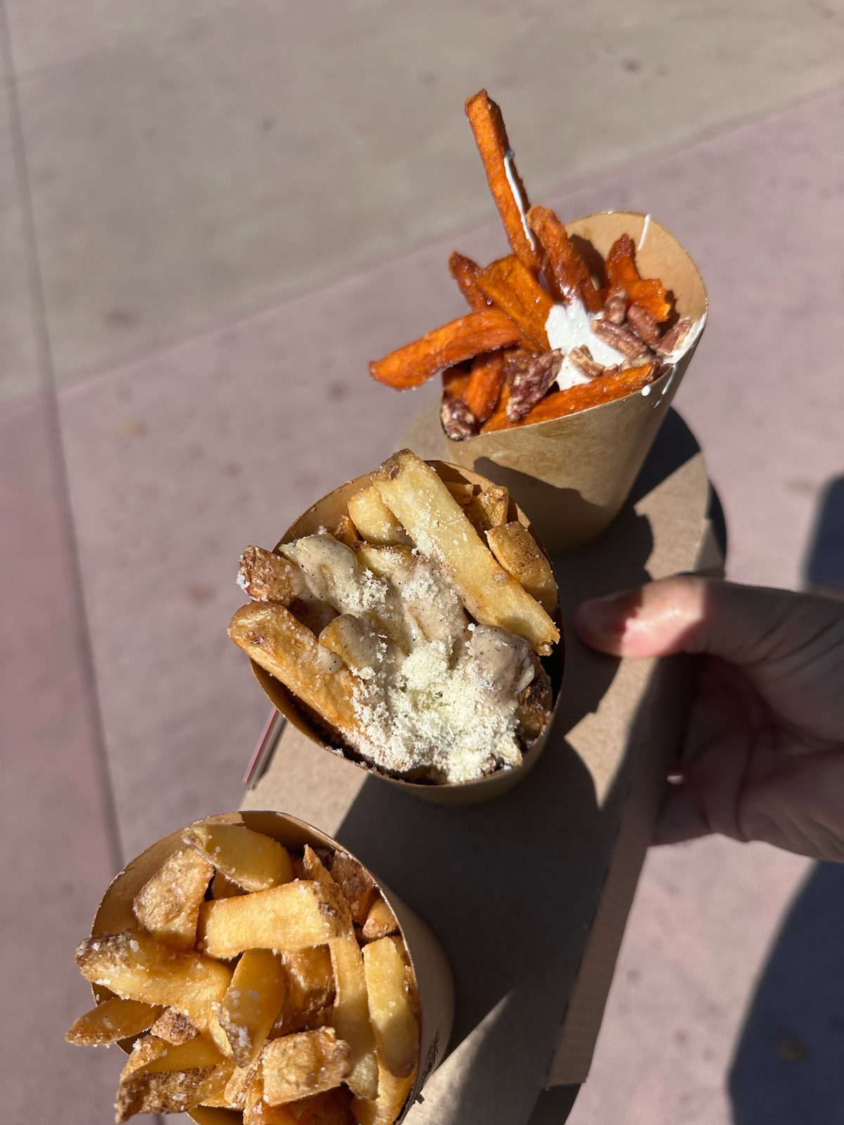 Fry flight from The Fry Basket with three tubs of fries