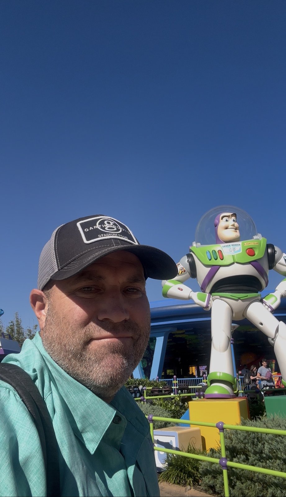 Ryan with the Buzz Lightyear statue in Toy Story Land