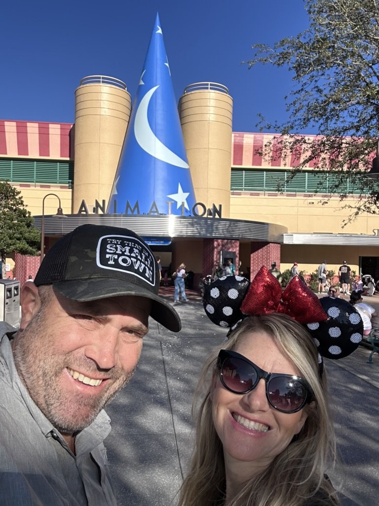 Ryan and Sarah at the Animation Courtyard entrance under the sorcerer hat