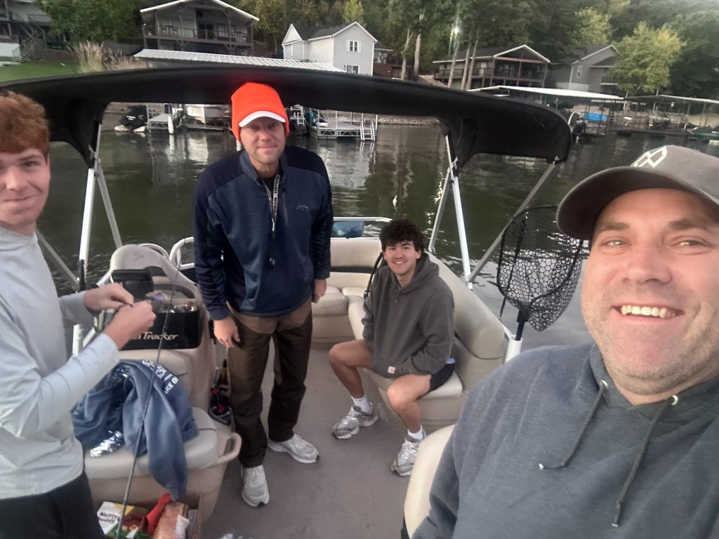 Ryan, Bryce, Joel, and Andrew on the pontoon at Lake of the Ozarks