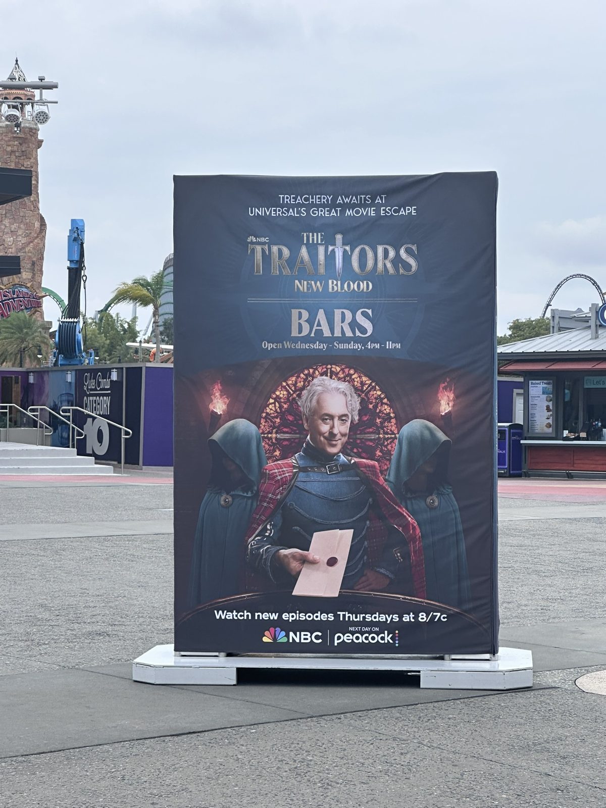 The Traitors: New Blood Bars sign at Universal's Great Movie Escape listing Wednesday–Sunday, 4 PM–11 PM hours